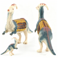 Soportes creativos para mazorcas de maíz con forma de dinosaurio