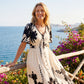Elegante vestido midi con escote en V y estampado botánico