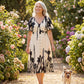 Elegante vestido midi con escote en V y estampado botánico
