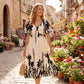 Elegante vestido midi con escote en V y estampado botánico