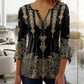 Top de botones con cuello en V y estampado floral y mangas acampanadas