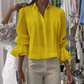 Camisa elegante con mangas de volantes y pliegues