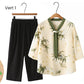 Elegante conjunto de top con cuello en V y pantalones rectos