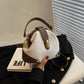 Bolso elegante y con bloques de color