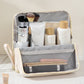 Elegante bolsa de cosméticos con compartimentos para llevar en la mano