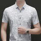 Camisa de solapa de manga corta con patrón geométrico abstracto chic para hombre