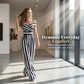 Mono elegante de mujer con hombros descubiertos y pierna ancha
