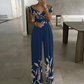 Mono elegante de mujer con hombros descubiertos y pierna ancha